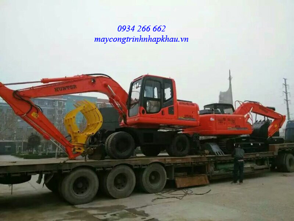 máy xúc đào bánh lốp HENGTE gầu 0.55m3